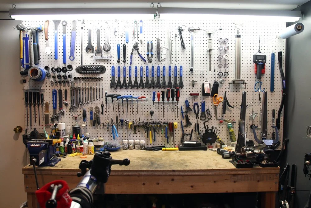 Bicycle mechanic preparing tools before a repair appointment