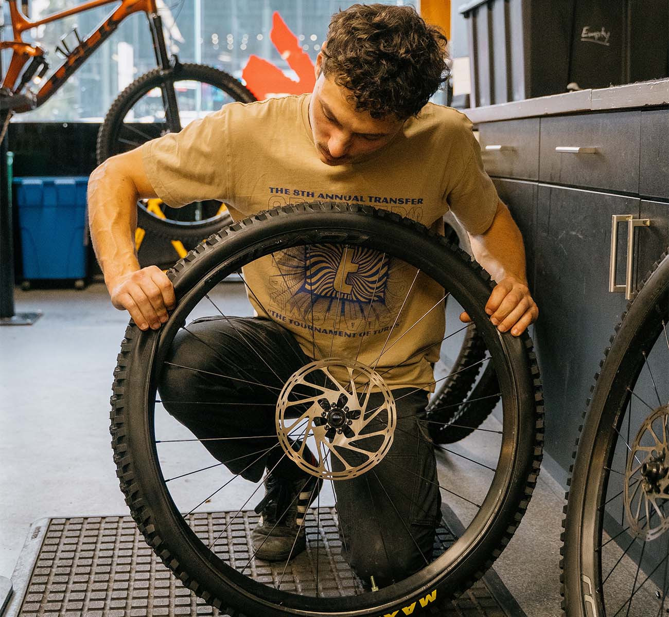 Bicycle mechanic adjusting gears and drivetrain components